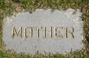 "Mother" inscription on gravestone flat in ground