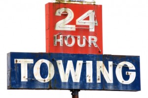 24 hour towing sign