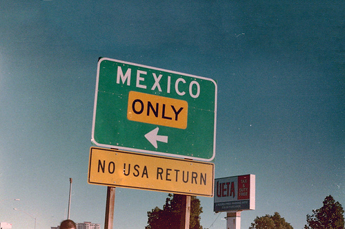 A highway sign on border that says mexico only no usa return