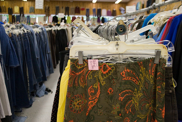 inside a thrift store racks of clothes