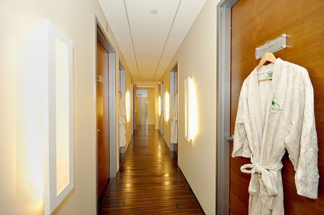 fitting room hallway one robe hanging up on a door