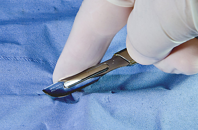 Close up of dr Using scalpel