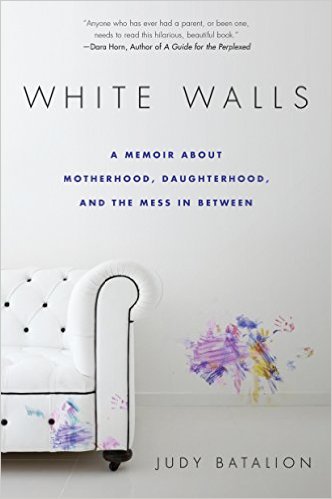 cover of white walls couch and wall with finger paint