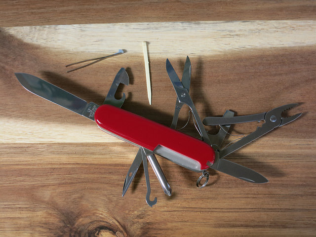 Swiss army knife with all its extensions out like corkscrew and knife blade