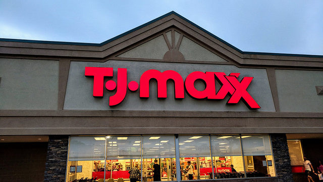 Exterior of TJ Maxx store with name in red lights