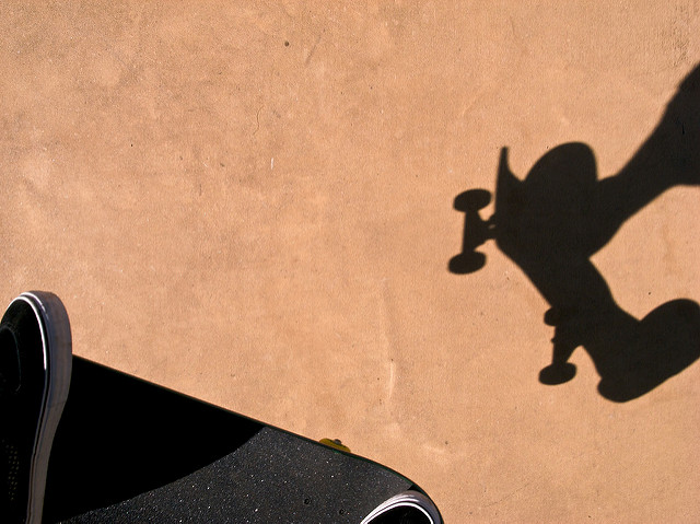Shadow of skateboard rider doing ollie jump