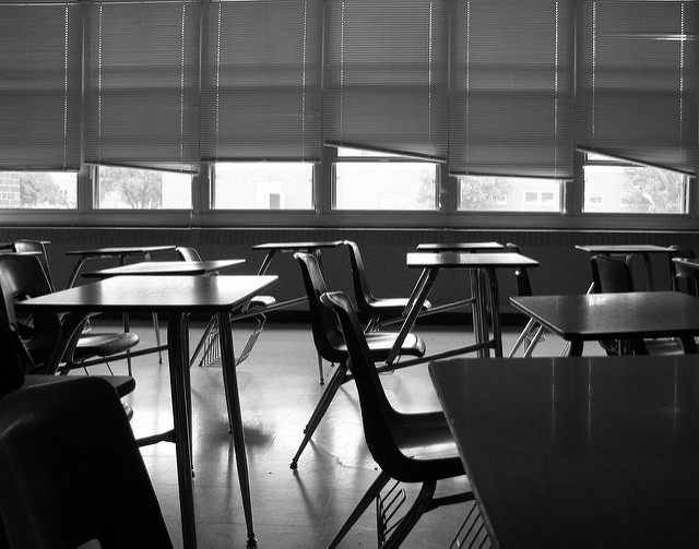 black and white photo of empty classroom