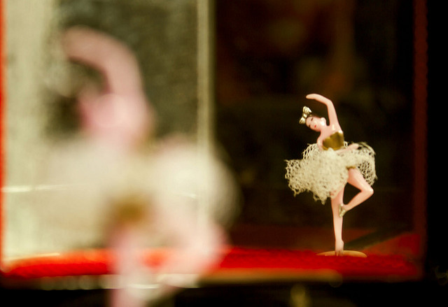 Ballerina in a music box reflection in mirror