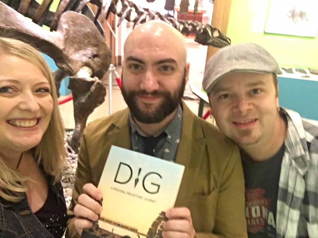donna, sam, and kevin, with sam's book and dinosaur bones behind us