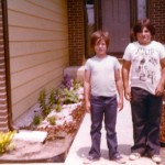 cory fosco and his brother in front of their house's walkway
