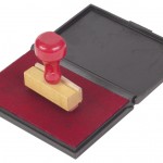 rubber stamp on red ink pad