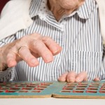 old woman with bingo card
