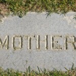 "Mother" inscription on gravestone flat in ground