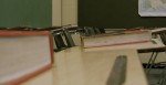empty classroom close up of desks and books