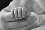 newborn hand in woman's