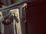 close-up shot of suitcase on zipper and wheel