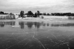 frozen lake with house in back