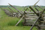 battlefield with wooden fence in middle - gettysburg pa