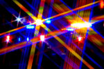 abstract of close-up of flashing lights - rays of blue, red, yellow and purple