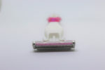 pink razor, blurry, with tip in foreground