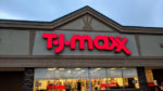 Exterior of TJ Maxx store with name in red lights