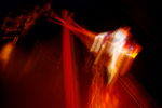 blurry image (to show motion) of a trapeze artist