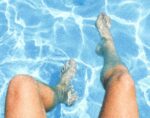feet and legs in pool