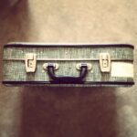 suitcase, vintage, shot from above with focus on handle and buckles