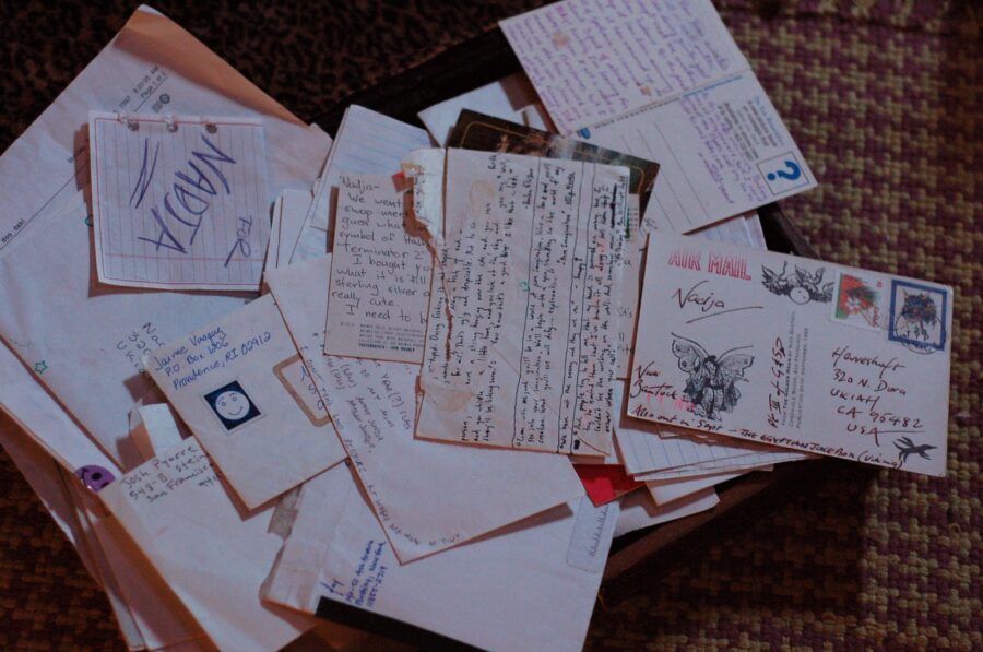 stack of old letters, postcards, and notes