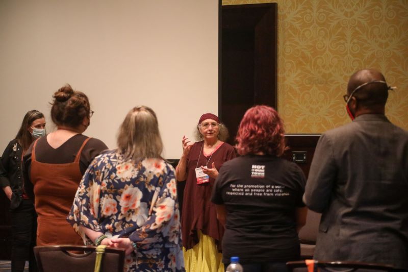 karen carnabucci presenting at HippoCamp 2021, with a semi-circle of attendees around her