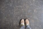 slippered feet on stone floor