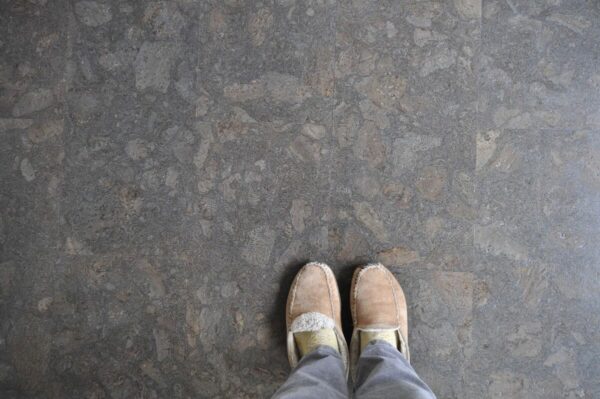 slippered feet on stone floor