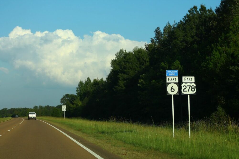 open road with cloudy blue sky, showing routes 6 and 278