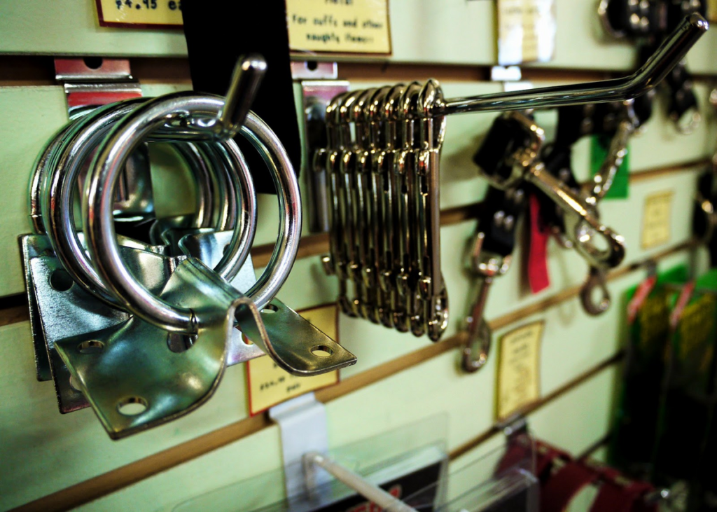 Hardware store rack with keychain acessories on pegs