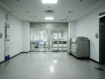 hallway leading to sliding doors of hospital ICU