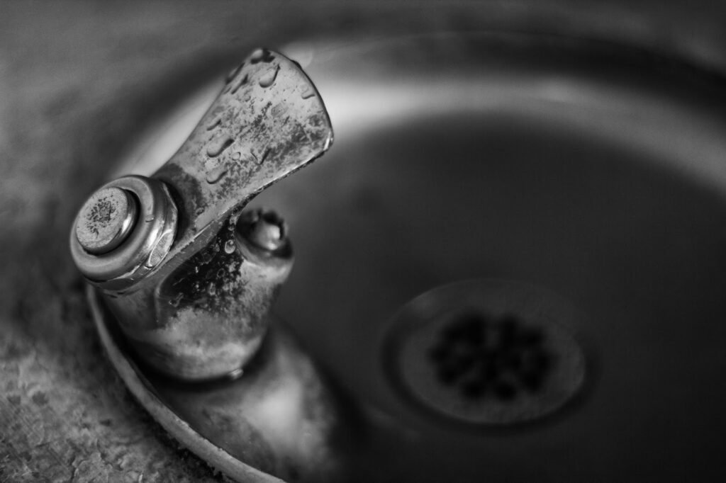 Close up of spout of public drinking fountain