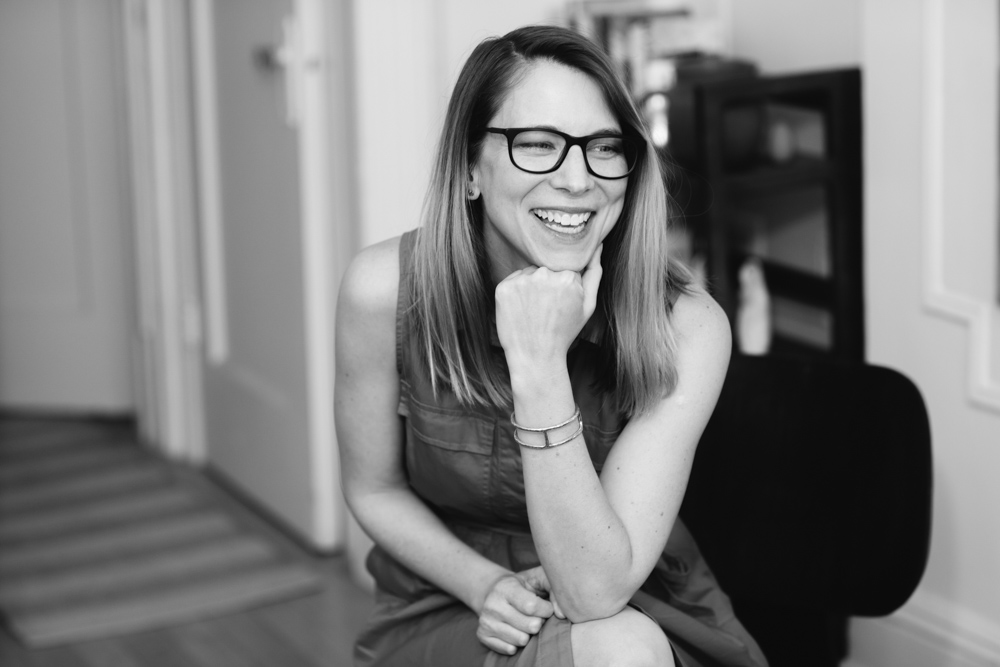 Black and White photo of Kelly McMasters, author of The Leaving Season: A Memoir in Essays, a white woman with long hair and glasses.