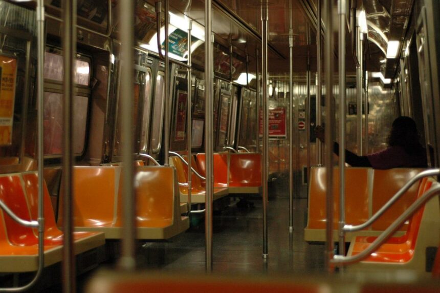 A subway train with orange seatsDescription automatically generated with medium confidence
