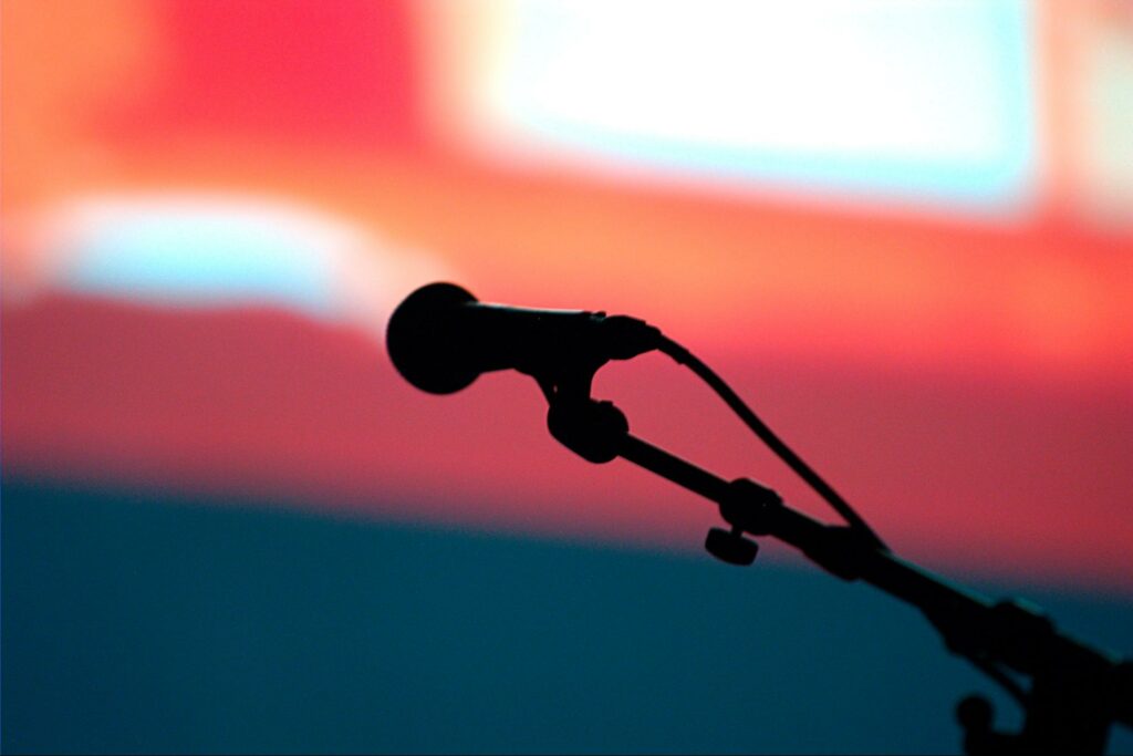 microphone silhouette with blurry background