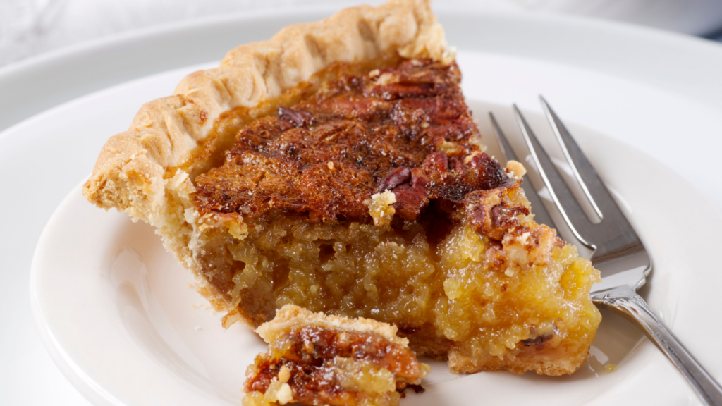 A piece of pecan pie on a plate