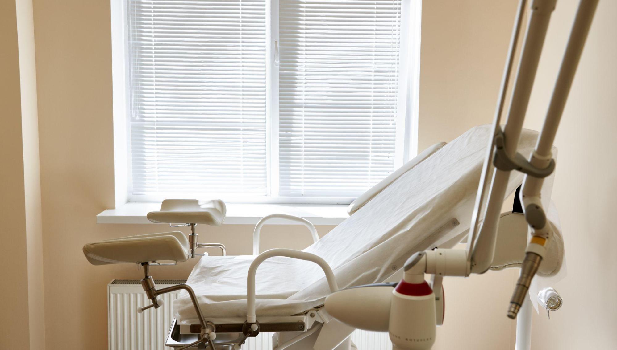 A medical chair in an exam room - evokes cold and sterile feel